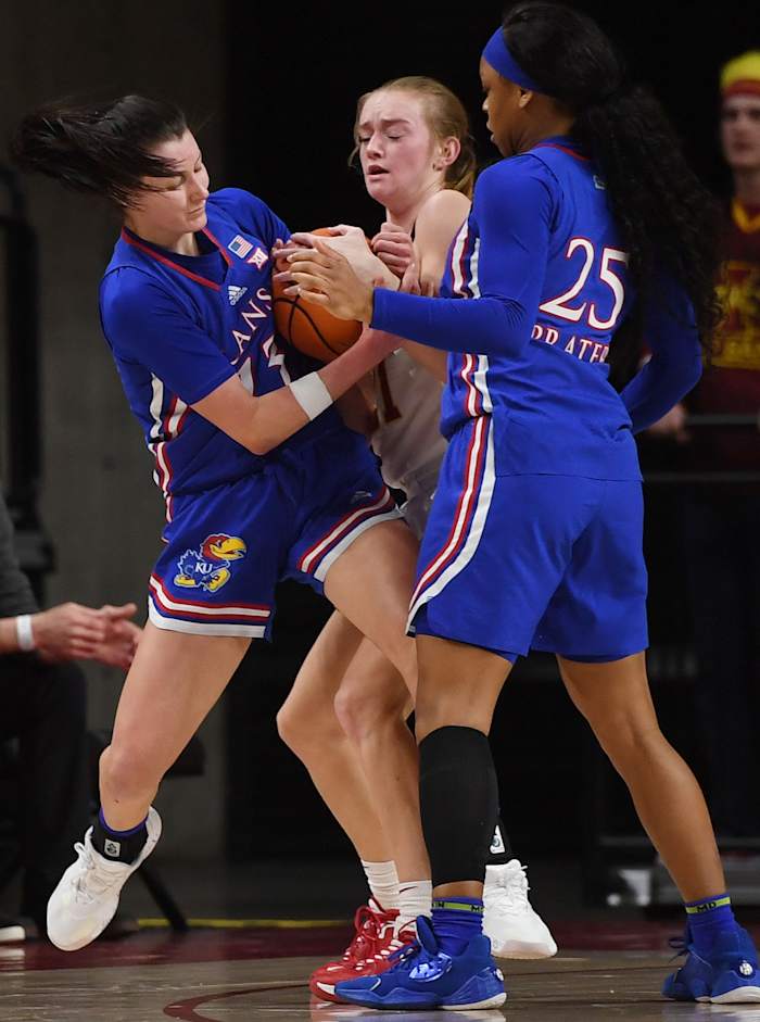 Iowa State Cyclones' guard Lexi Donarski (21) and Kansas' guard Holly Kersgieter (13) battle for the ball during the third quarter at Hilton Coliseum Wednesday, Jan. 26, 2022, in Ames, Iowa.
